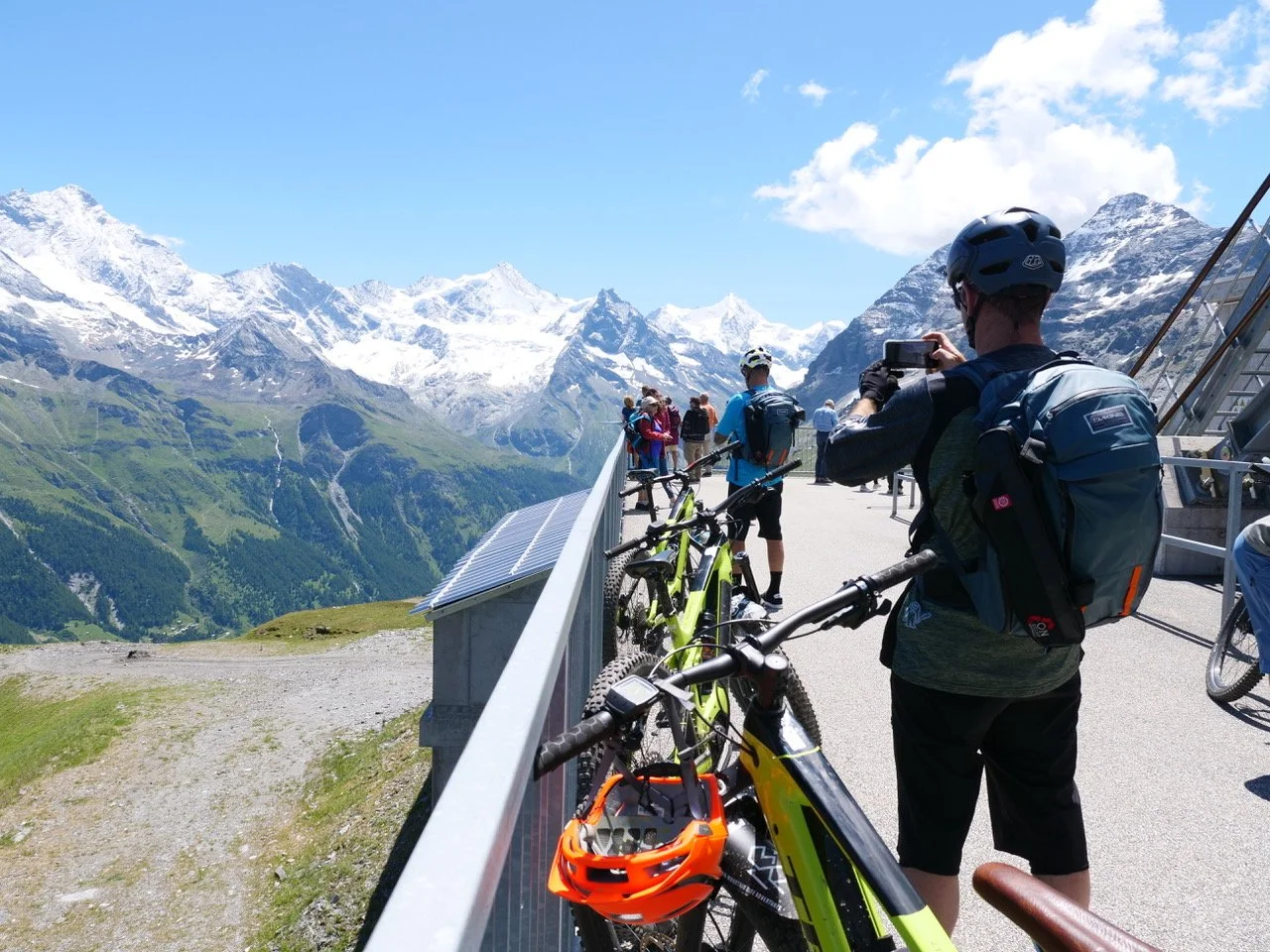 Mountain bikers taking photos with their phones