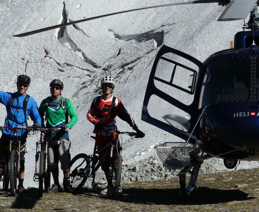 Getting an airlift from a helicopter during mountain biking