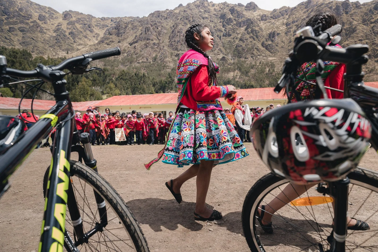 Girl in Peru seeing mountain bikes up close