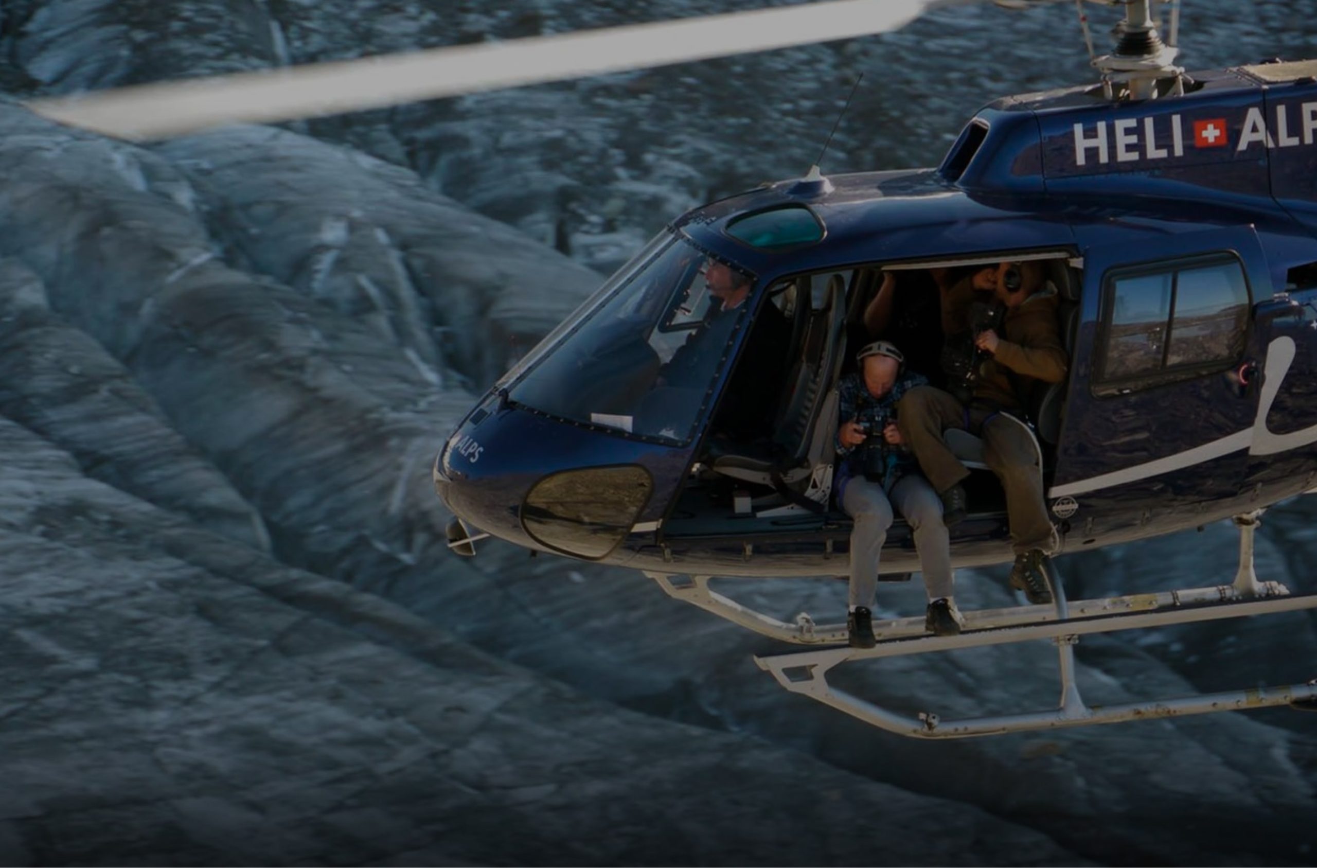 helicopter above rocky mountain