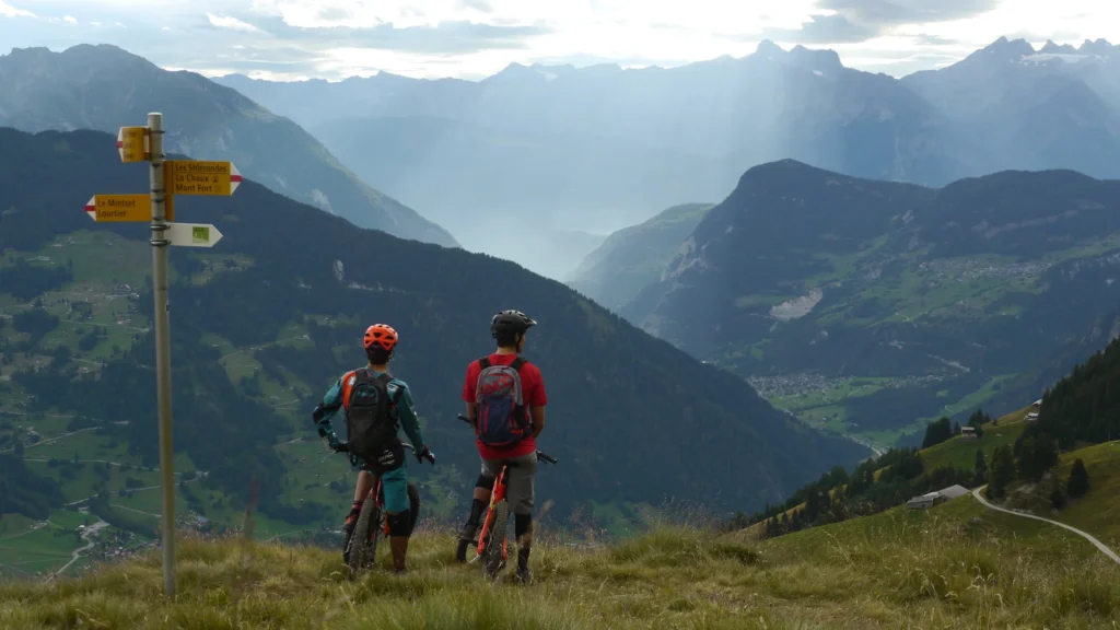 Le Chable-based rider Ludo May and Stephen Matthews gazing out over the Val de Bagnes before dropping into the La Vallée Express trail that ends on the door-step of the hotel.