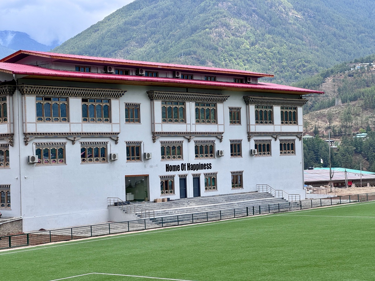 building in Bhutan with happiness quote