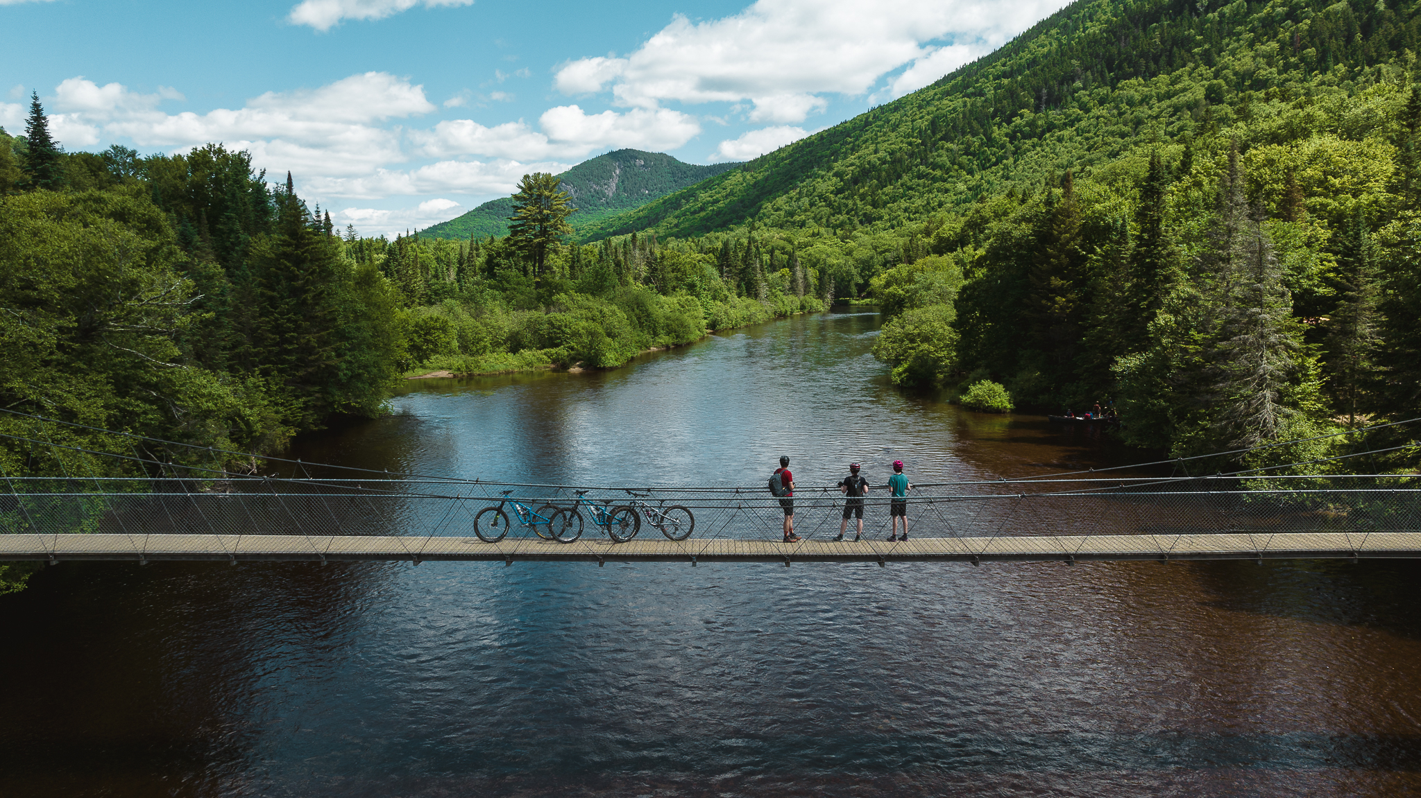 Mountain bikers on bridge in quebec